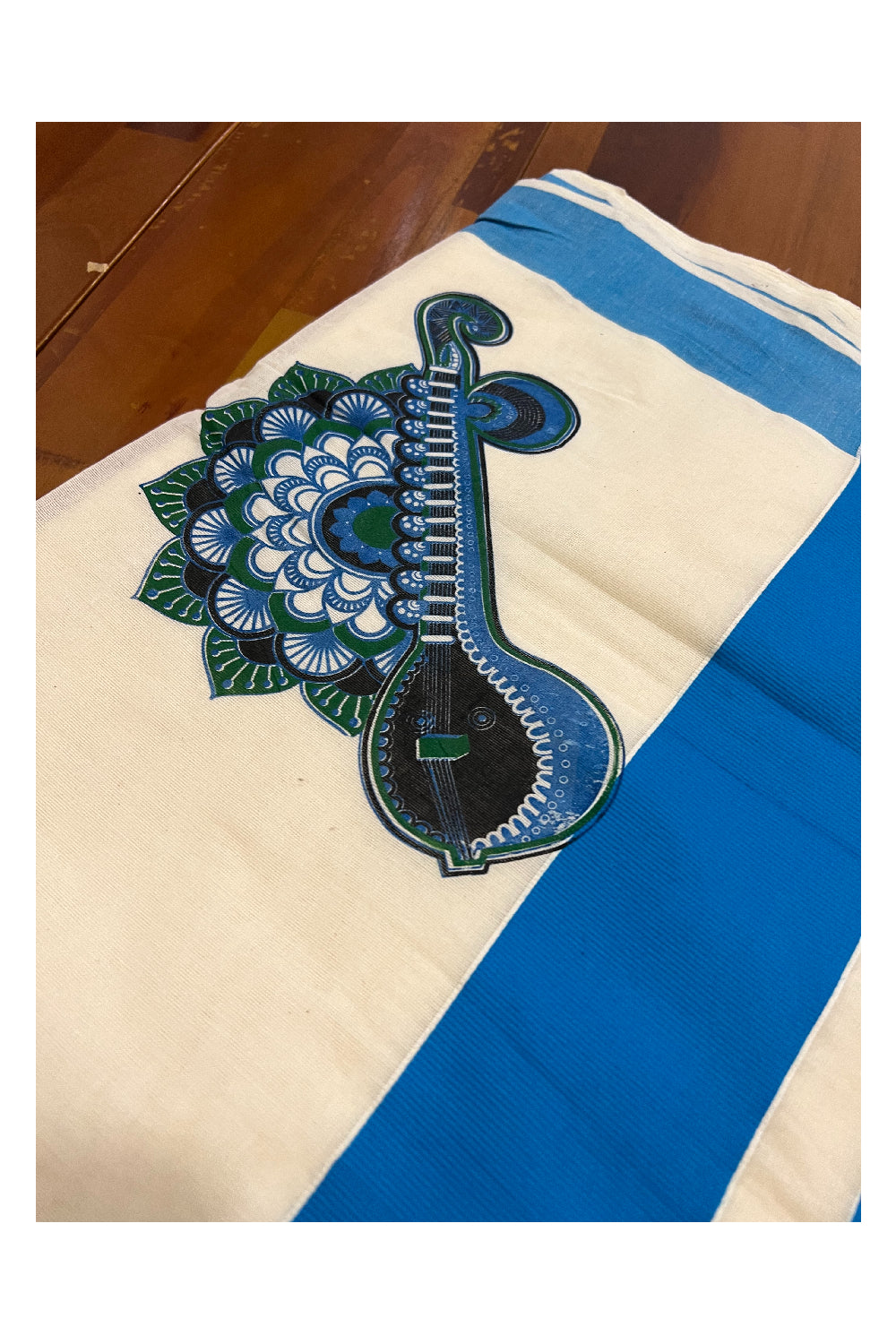 Pure Cotton Kerala Light Blue Border Saree with Mural Veena and Floral Design