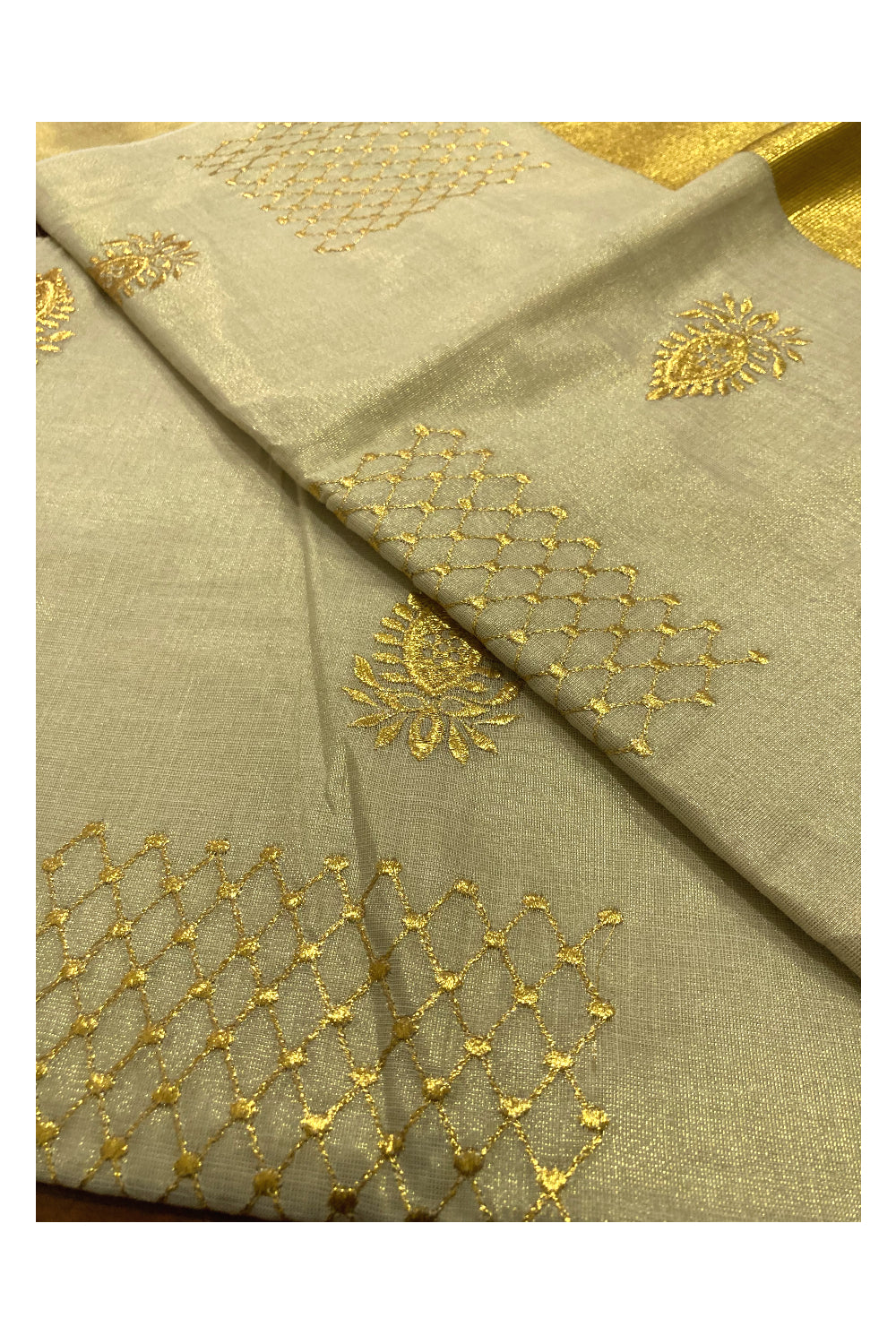 Kerala Tissue Kasavu Saree with Floral Golden Embroidery Works