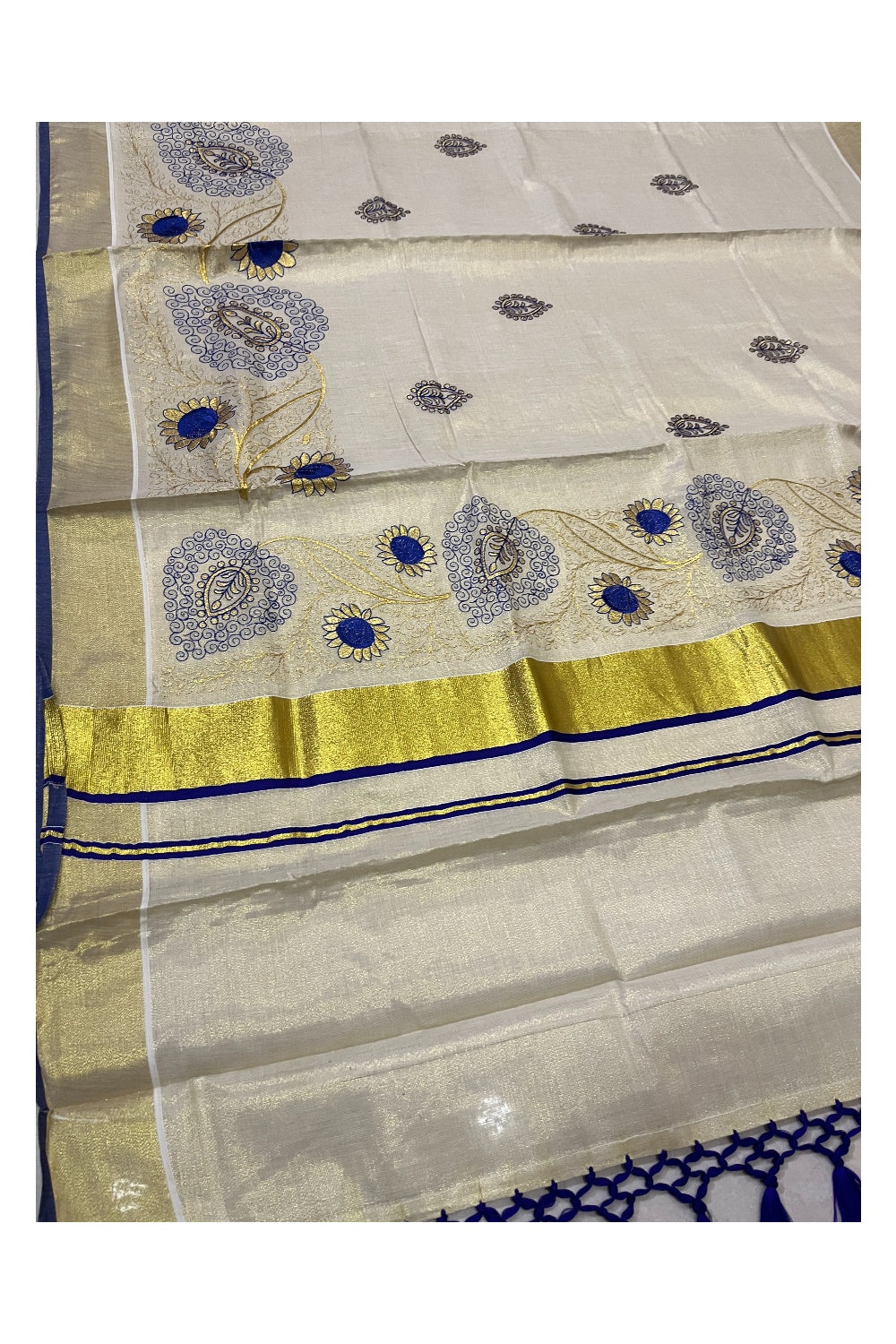 Kerala Tissue Kasavu Heavy Work Saree with Golden and Blue Floral Embroidery Design