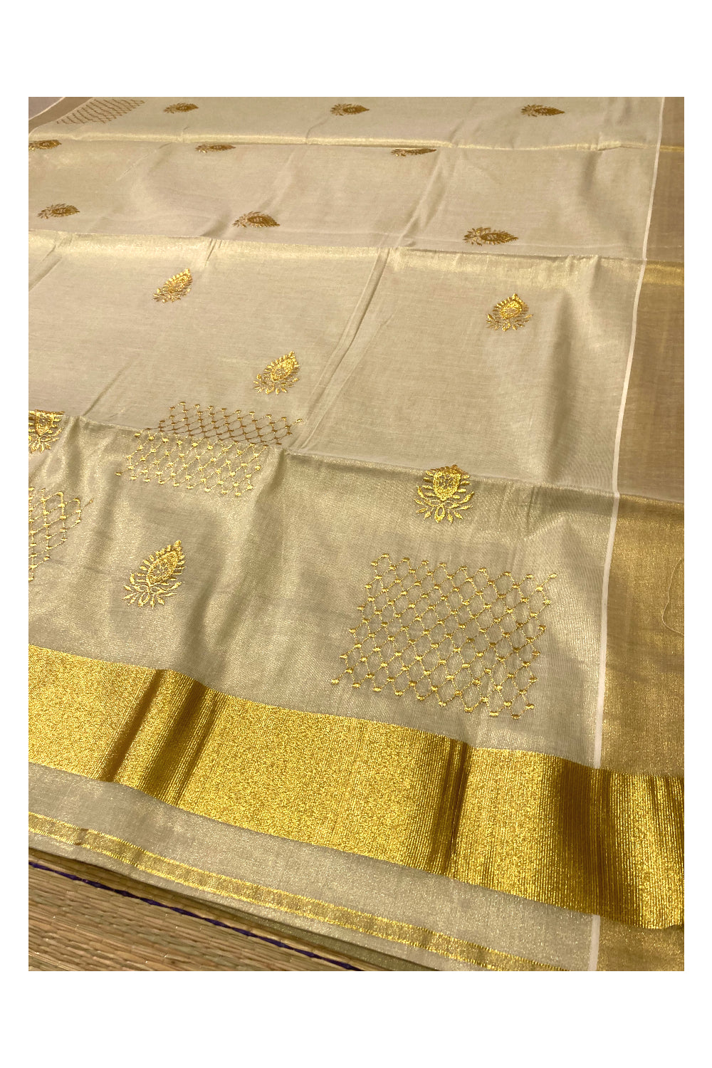 Kerala Tissue Kasavu Saree with Floral Golden Embroidery Works