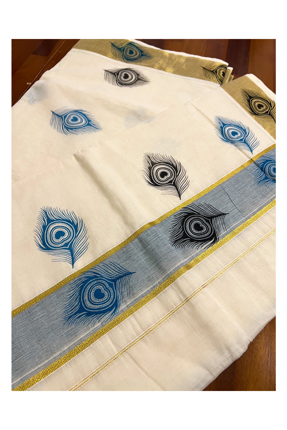 Pure Cotton Kerala Kasavu Saree with Light Blue and Black Feather Block Printed Design