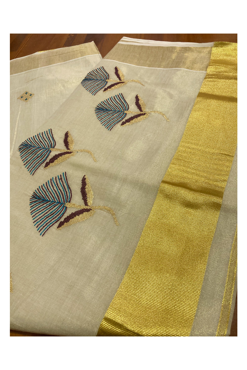 Kerala Tissue Kasavu Saree with Floral Embroidery Works