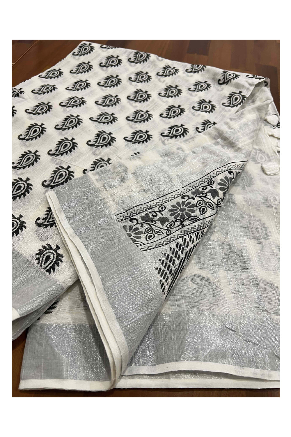 Southloom Linen Designer Saree in Black Prints on White Body with Tassels