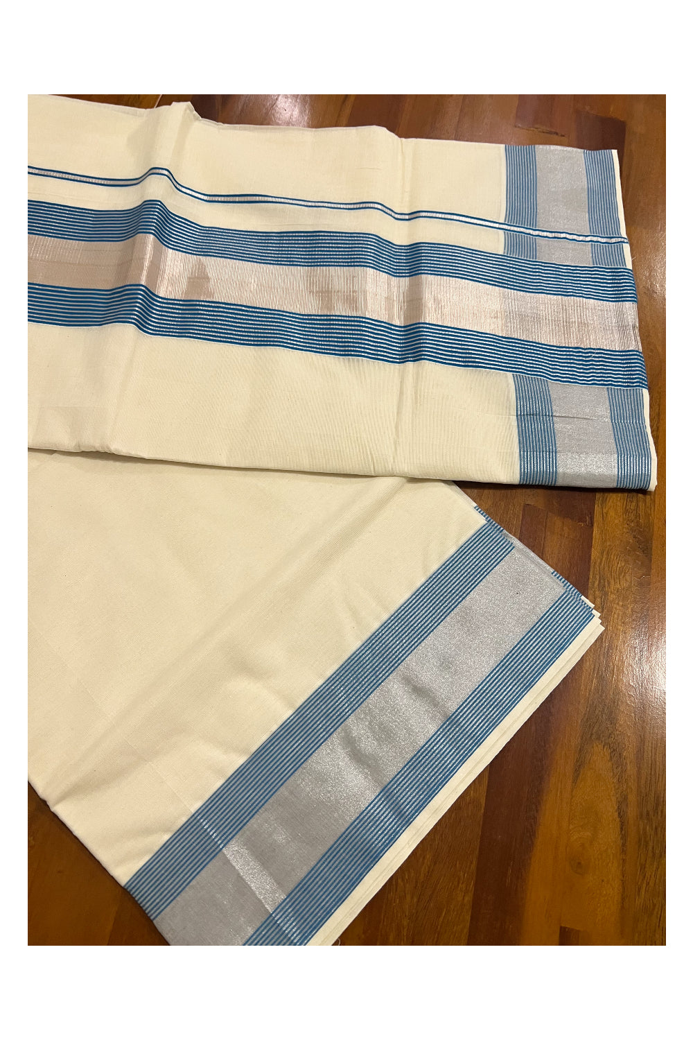 Pure Cotton Kerala Plain Saree with Silver Kasavu and Light Blue Line Border