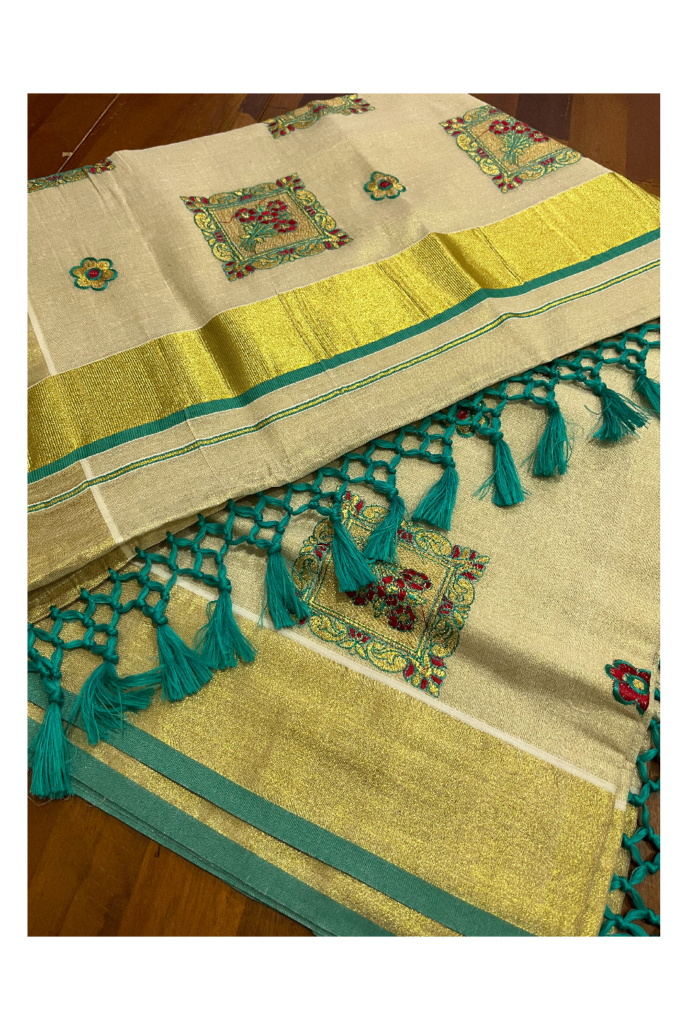 Kerala Tissue Kasavu Heavy Work Saree with Golden and Turquoise Floral Embroidery Design