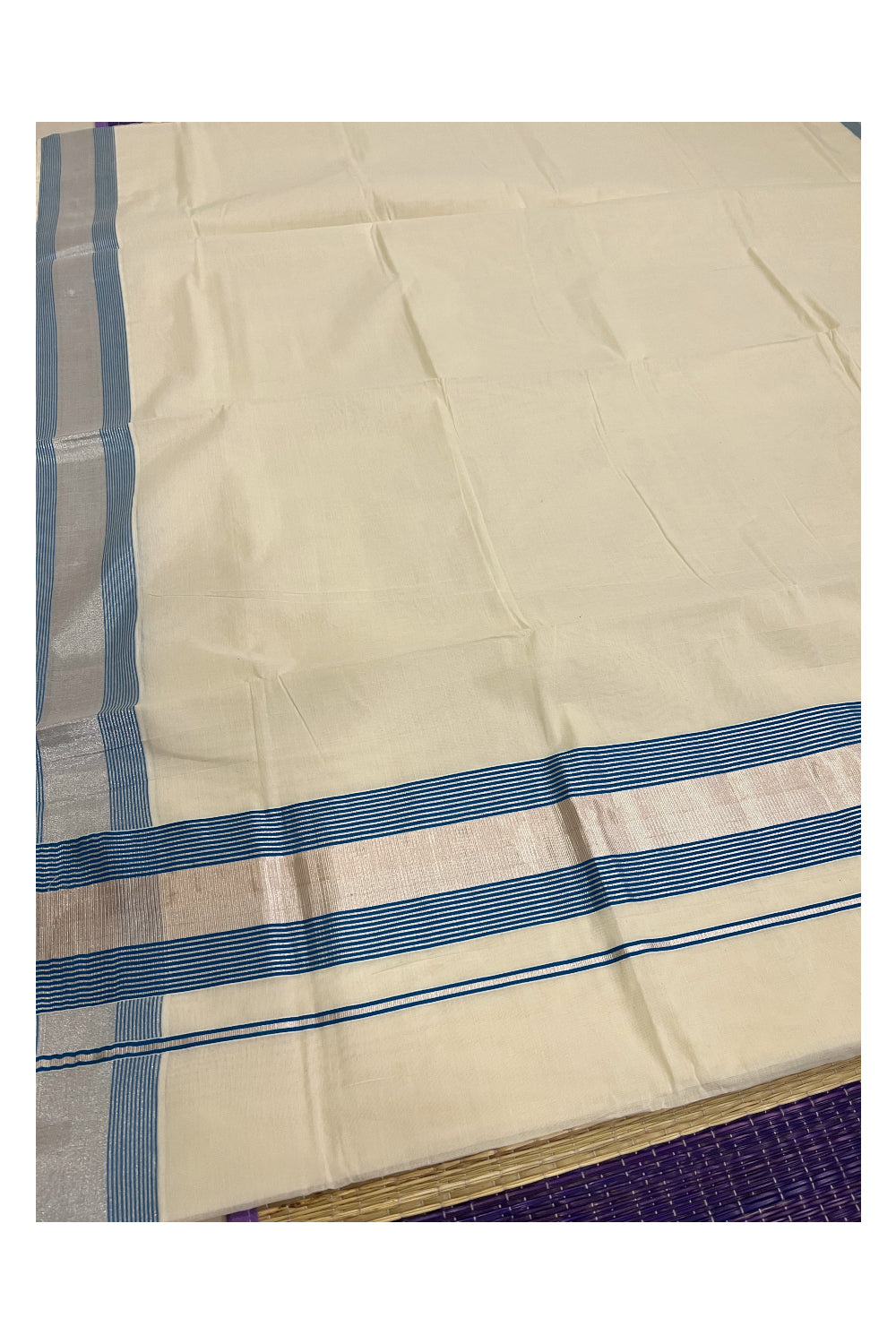 Pure Cotton Kerala Plain Saree with Silver Kasavu and Light Blue Line Border