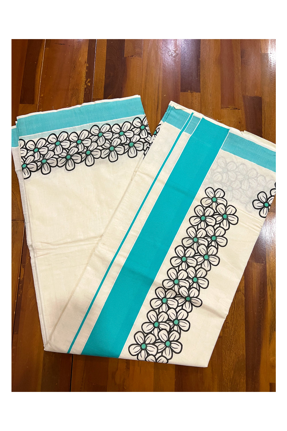 Southloom Onam 2022 Kerala Saree with Black Floral Block Prints and Turquoise Border