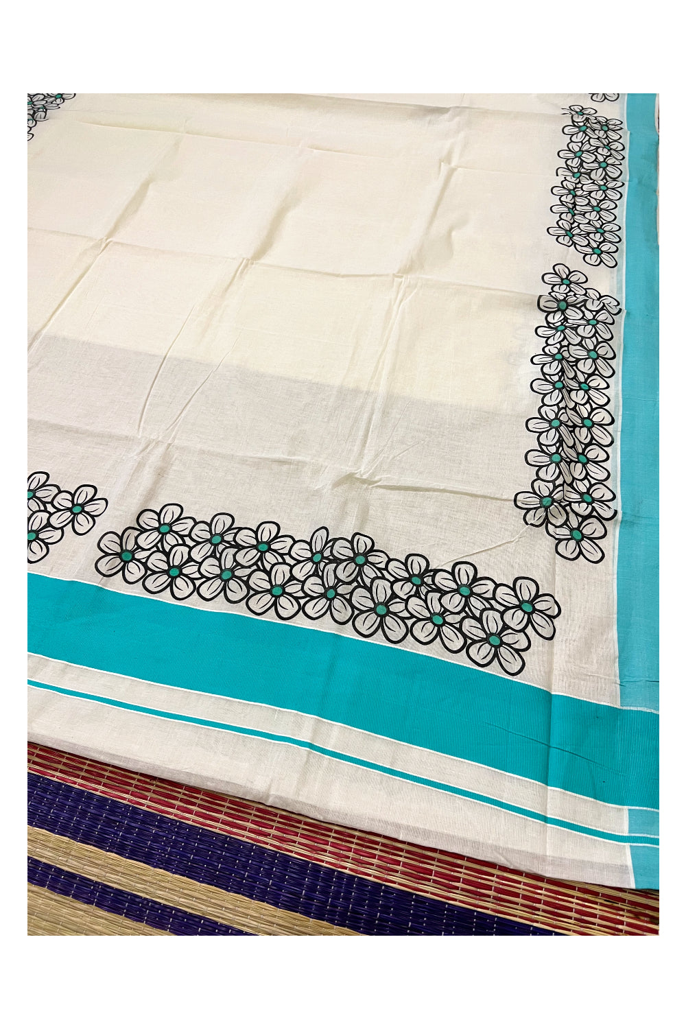 Southloom Onam 2022 Kerala Saree with Black Floral Block Prints and Turquoise Border