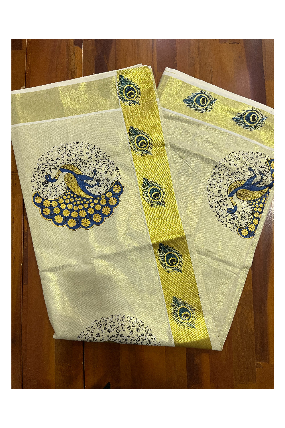 Kerala Tissue Kasavu Saree with Blue Peacock Mural Printed Design