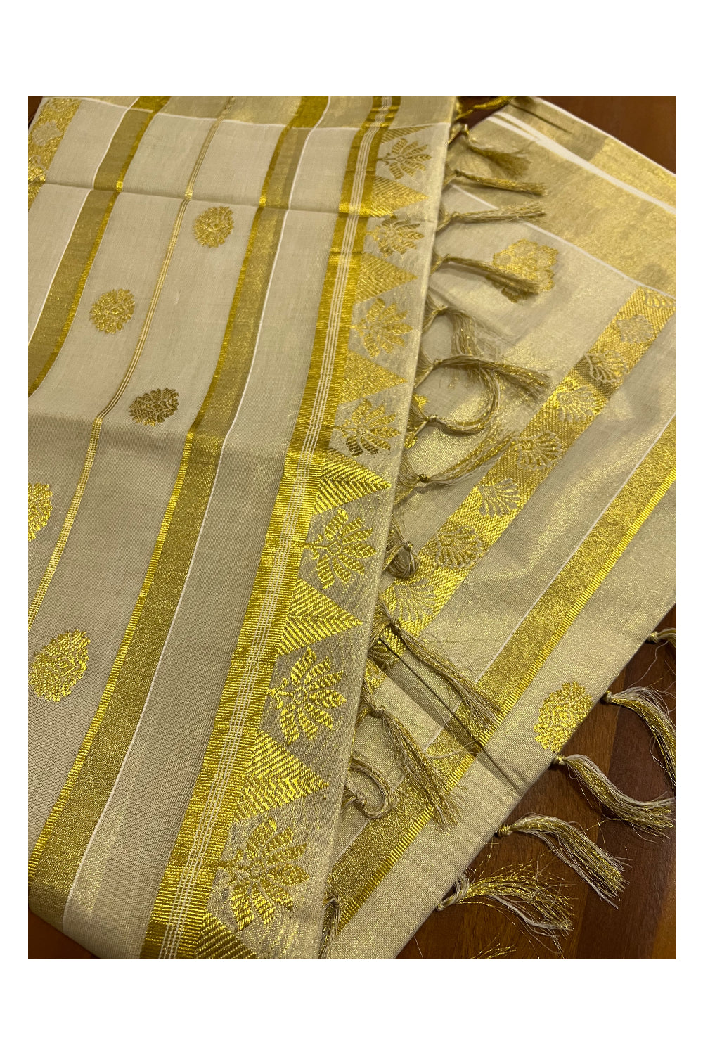 Kerala Tissue Heavy Work Saree with Floral Kasavu Patterns and Tassels on pallu
