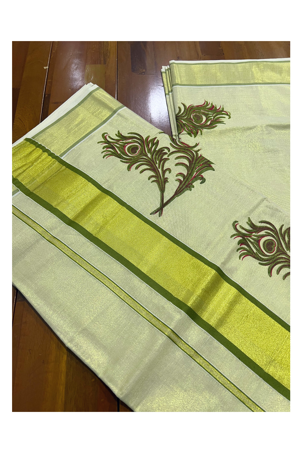 Kerala Tissue Kasavu Saree With Olive Green Peacock Feather Mural Design