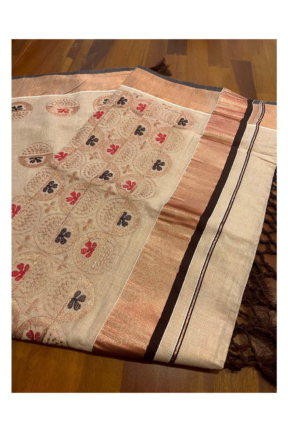 Southloom Copper Tissue Kasavu Saree with Embroidery Design and Brown Tassels Works on Pallu