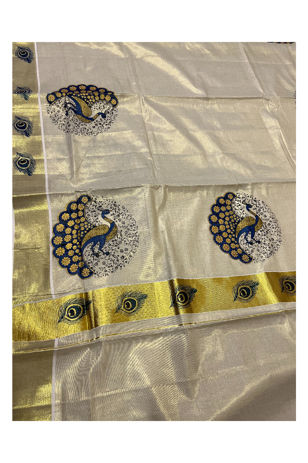 Kerala Tissue Kasavu Saree with Blue Peacock Mural Printed Design