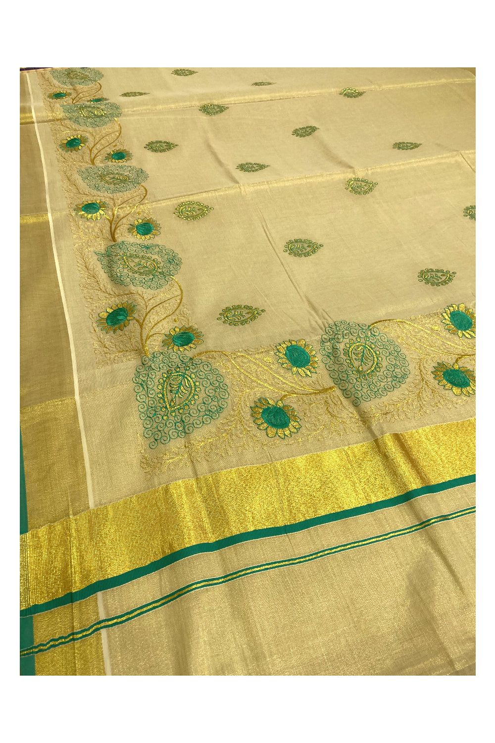 Kerala Tissue Kasavu Heavy Work Saree with Golden and Turquoise Feather Embroidery Design