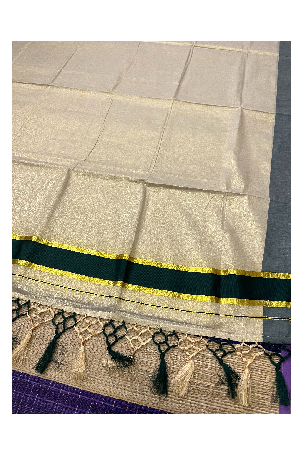 Kerala Kasavu Tissue Plain Saree with Dark Green and Kasavu Border and Tassels Work on Pallu