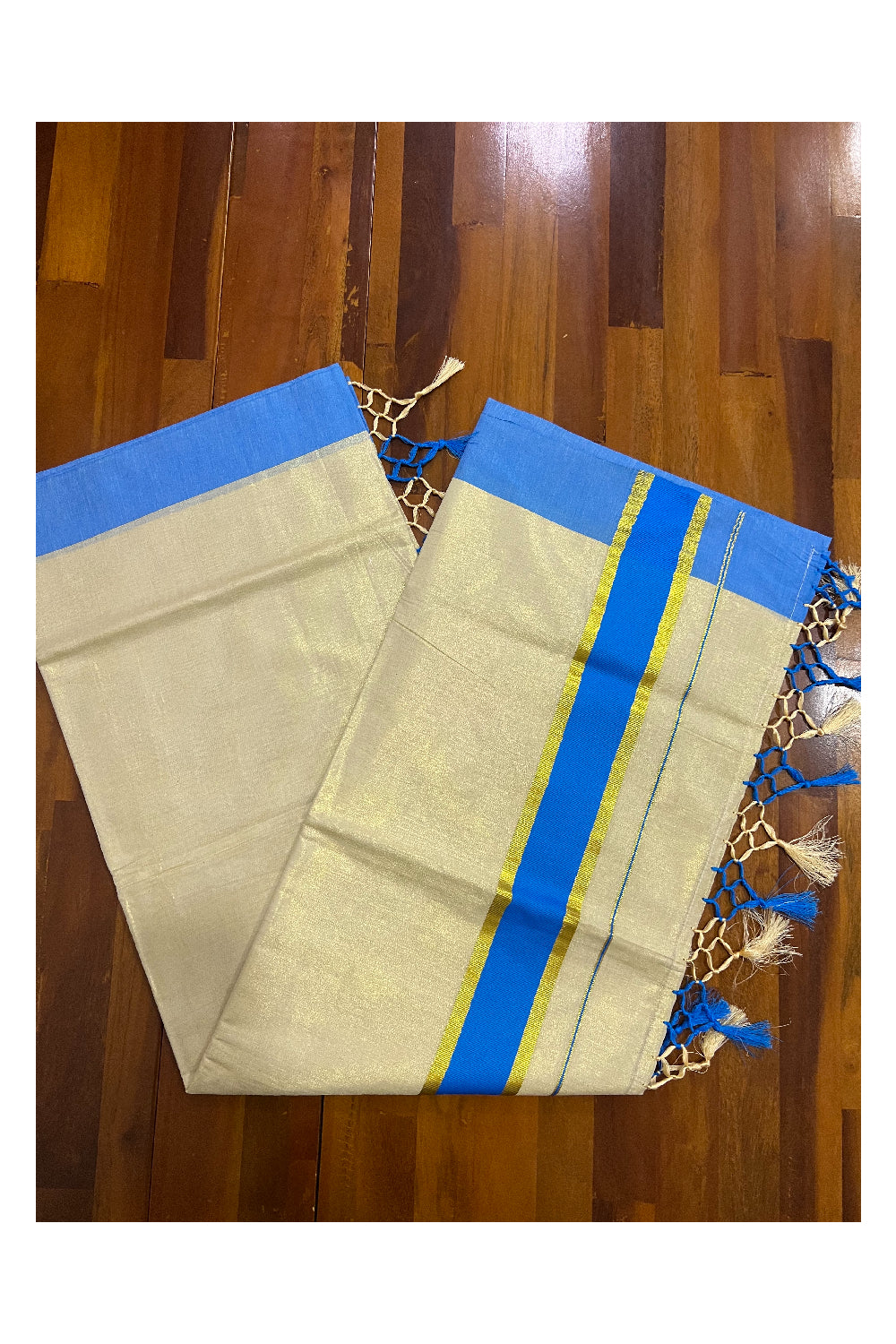 Kerala Kasavu Tissue Plain Saree with Light Blue and Kasavu Border and Tassels Work on Pallu