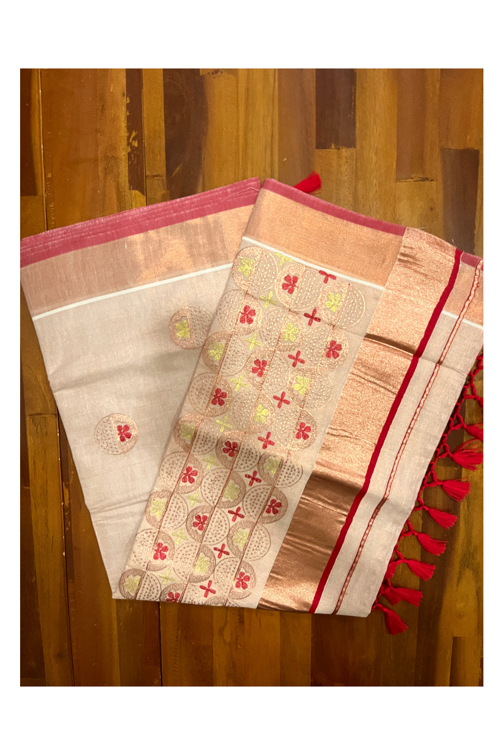 Southloom Copper Tissue Kasavu Saree with Embroidery Design and Red Tassels Works on Pallu