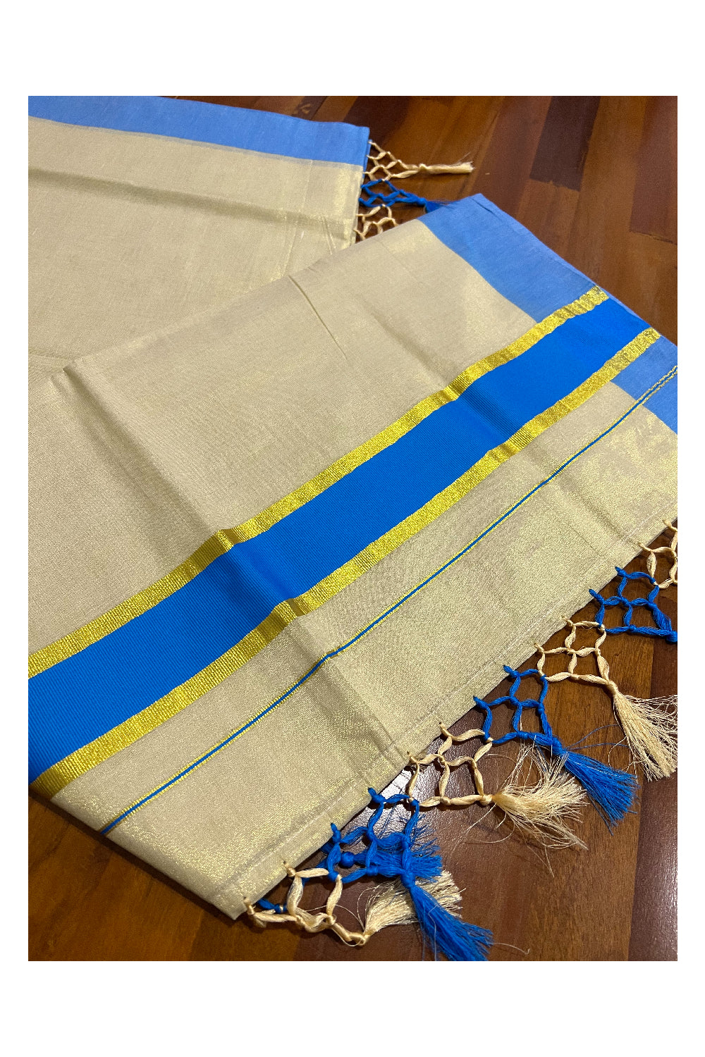 Kerala Kasavu Tissue Plain Saree with Light Blue and Kasavu Border and Tassels Work on Pallu