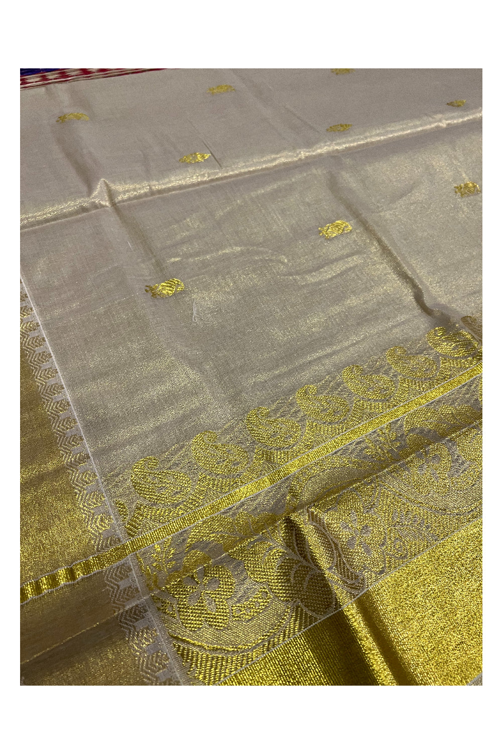 Kerala Tissue Kasavu Saree with Paisley Floral Woven Heavy Work Design