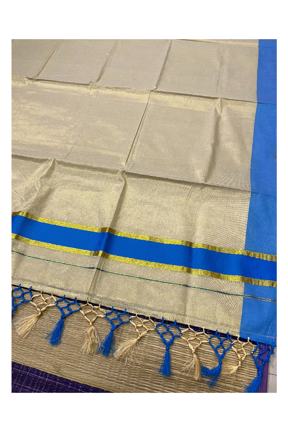 Kerala Kasavu Tissue Plain Saree with Light Blue and Kasavu Border and Tassels Work on Pallu