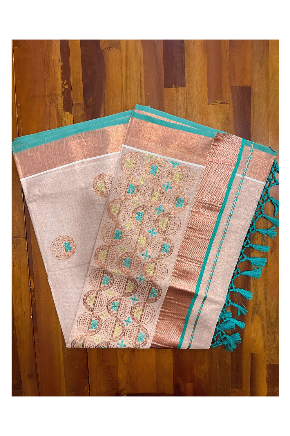 Southloom Copper Tissue Kasavu Saree with Embroidery Design and Turquoise Tassels Works on Pallu