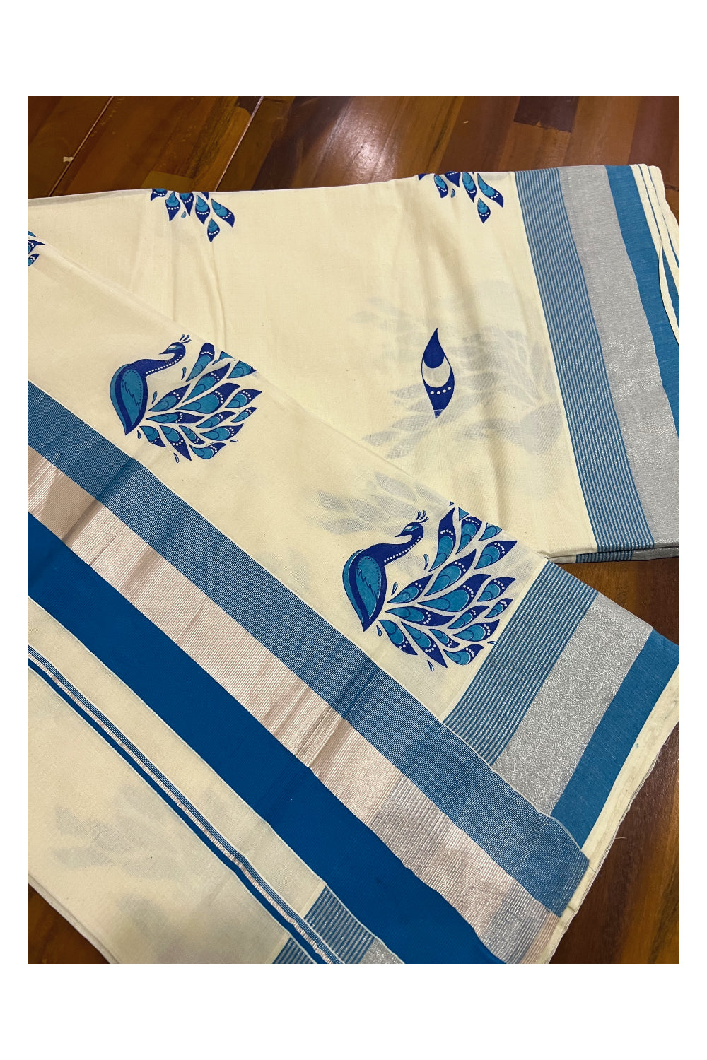 Kerala Pure Cotton Light Blue and Silver Kasavu Border Saree with Peacock Mural Printed Design