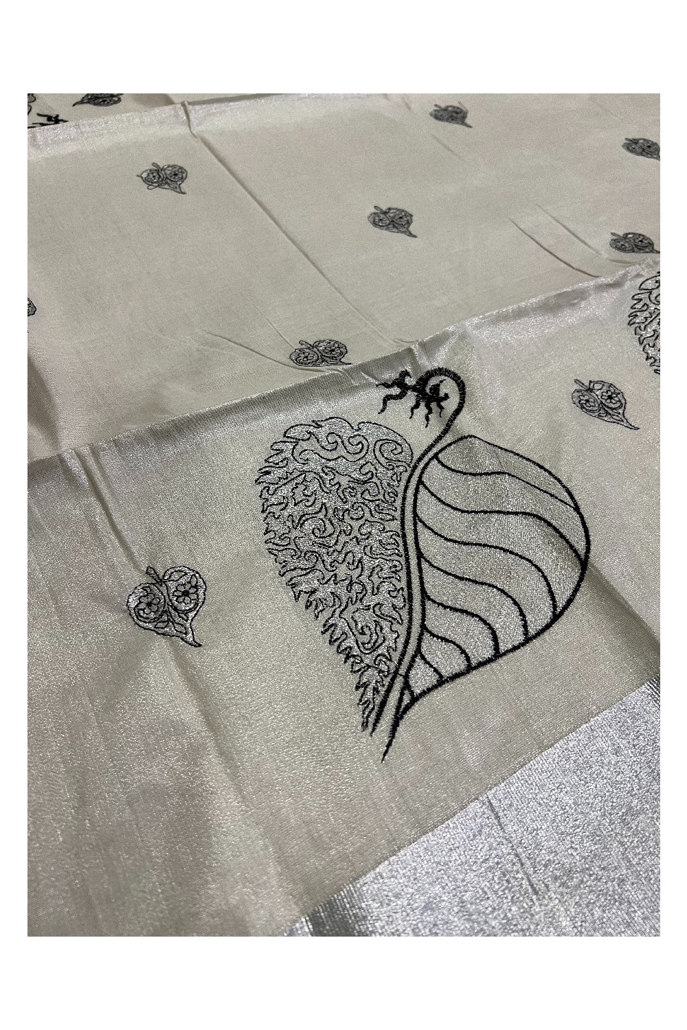 Kerala Silver Tissue Kasavu Saree with Black Leaf Embroidery Design