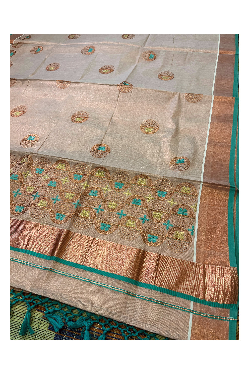 Southloom Copper Tissue Kasavu Saree with Embroidery Design and Turquoise Tassels Works on Pallu