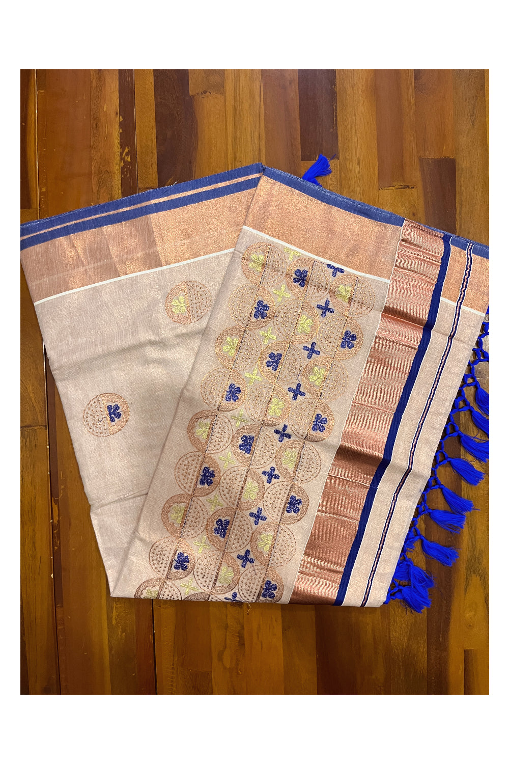 Southloom Copper Tissue Kasavu Saree with Embroidery Design and Blue Tassels Works on Pallu