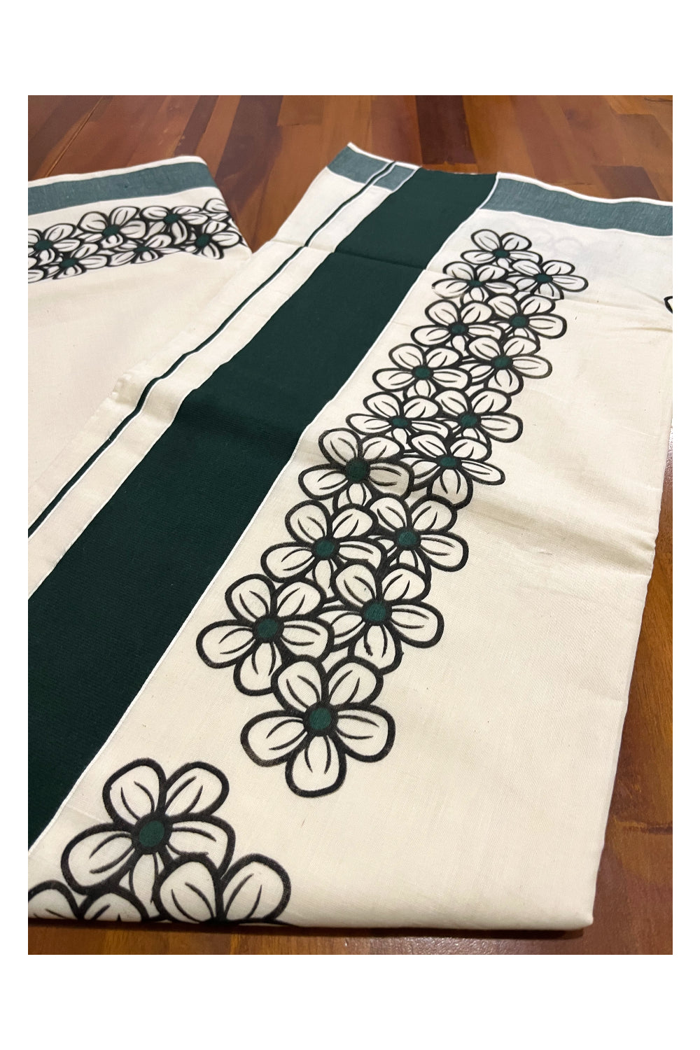 Pure Cotton Kerala Saree with Black Floral Block Prints and Dark Green Border
