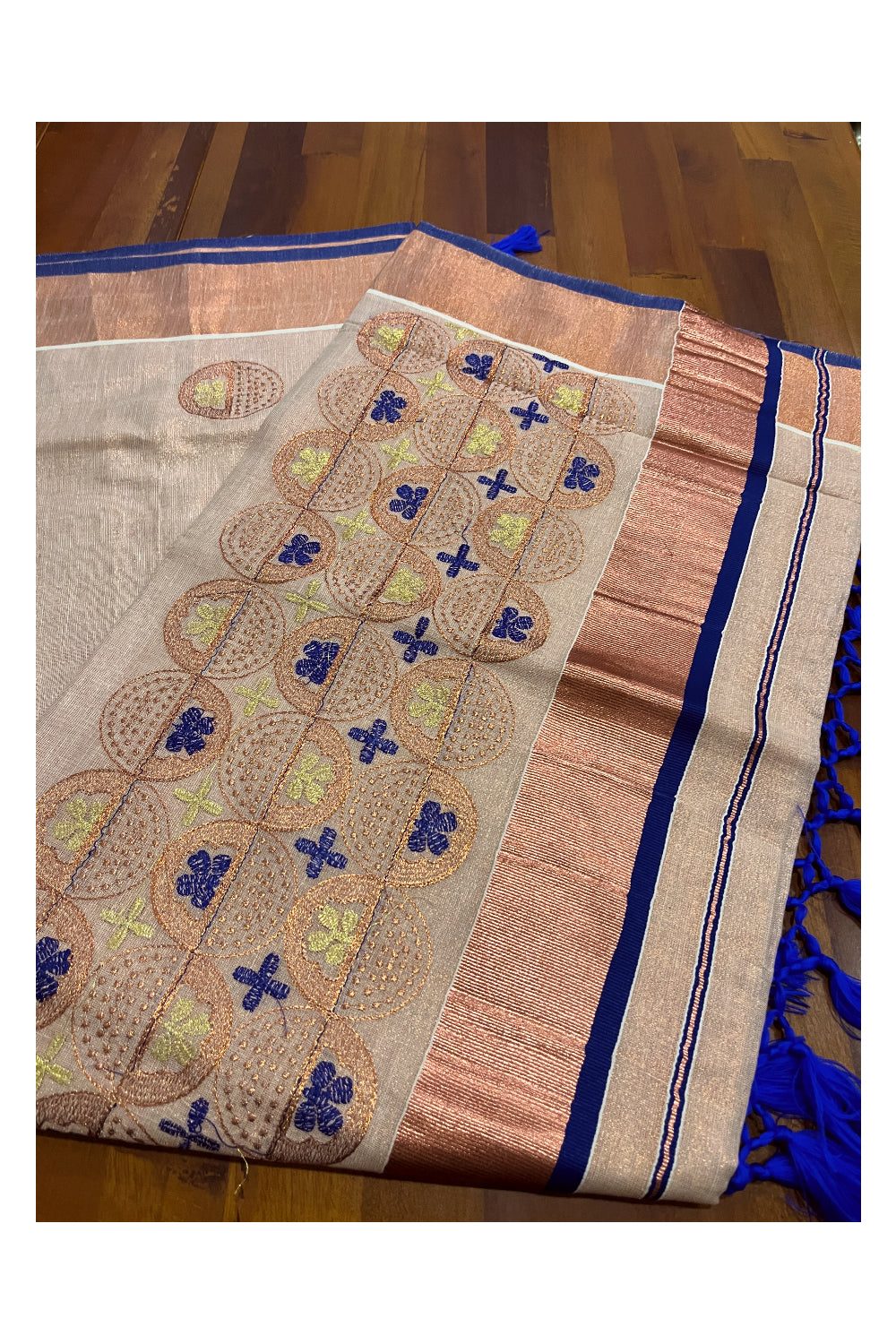 Southloom Copper Tissue Kasavu Saree with Embroidery Design and Blue Tassels Works on Pallu