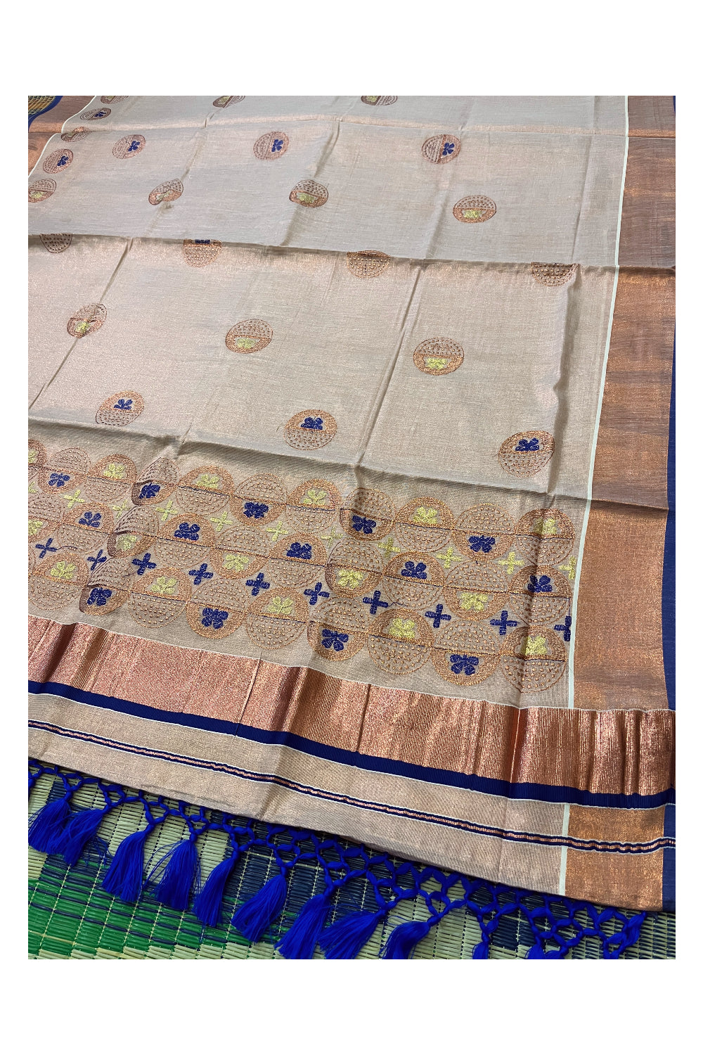 Southloom Copper Tissue Kasavu Saree with Embroidery Design and Blue Tassels Works on Pallu