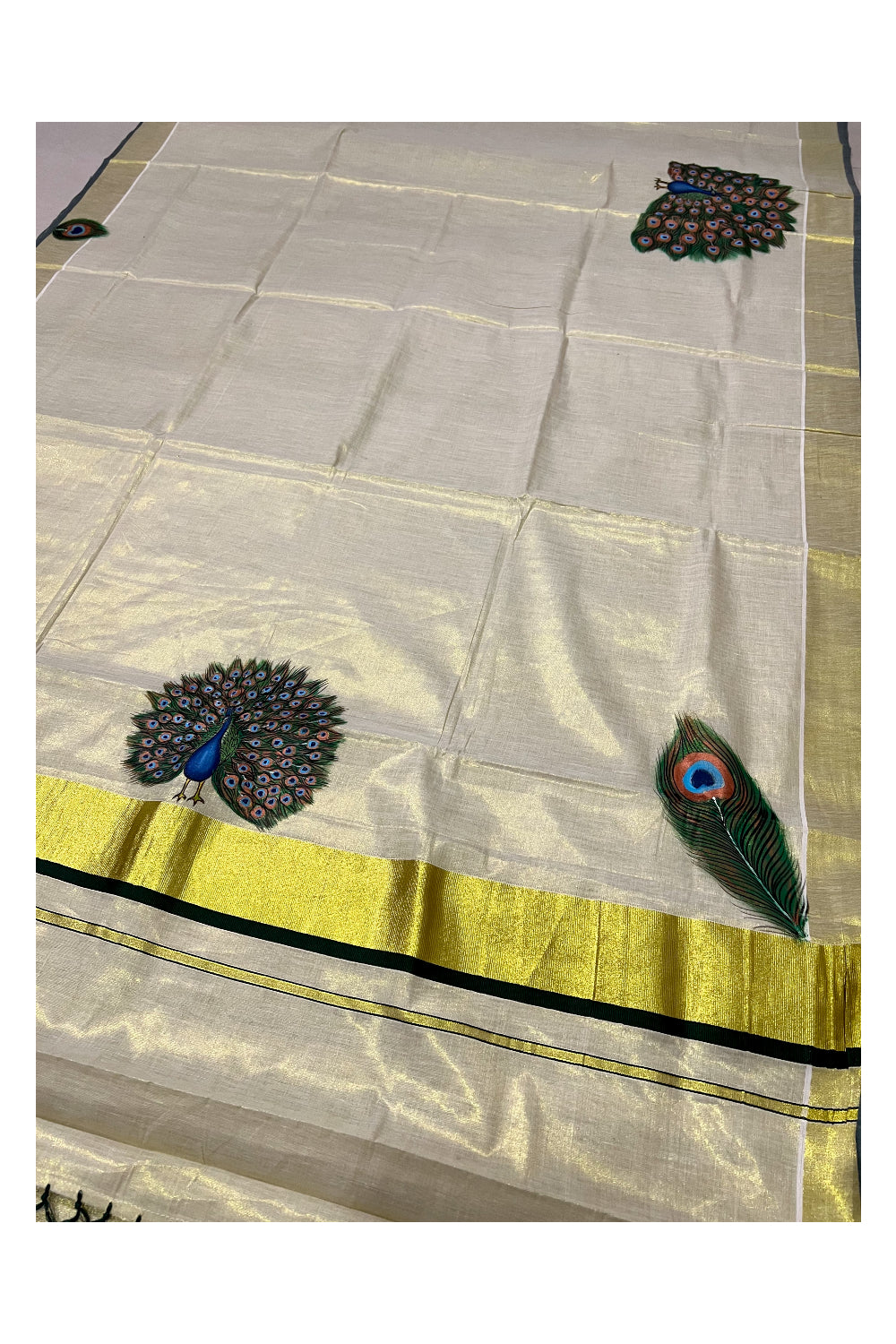 Kerala Tissue Kasavu Saree with Hand Painted Peacock Design and Dark Green Tassels Work