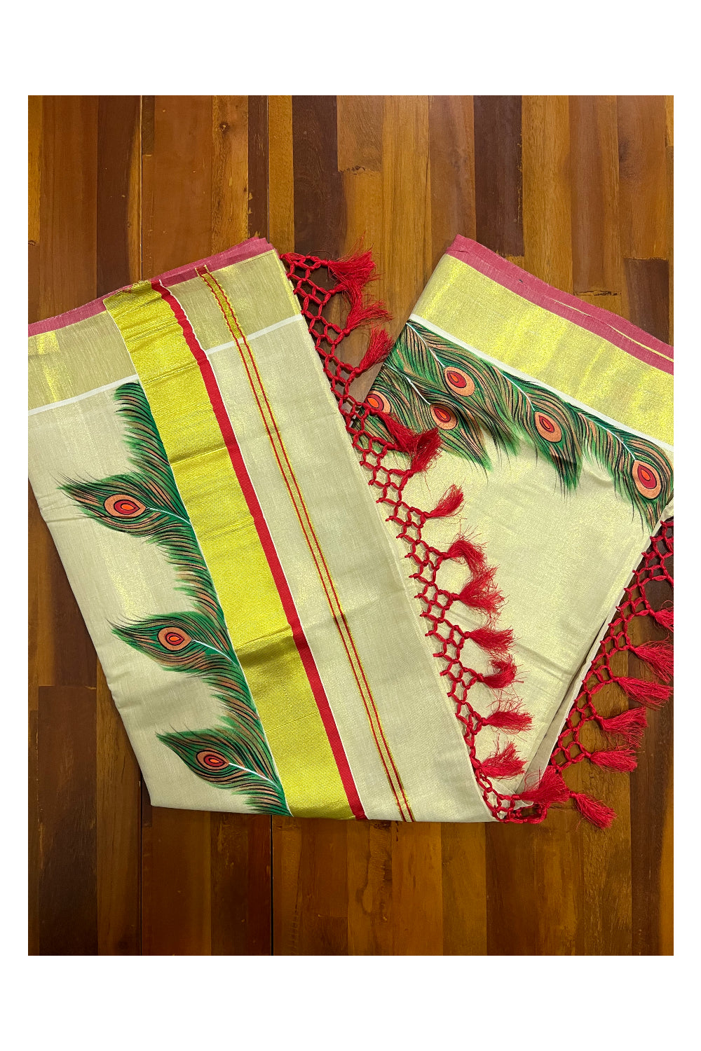 Kerala Tissue Kasavu Saree with Hand Painted Feather Design and Red Tassels Work