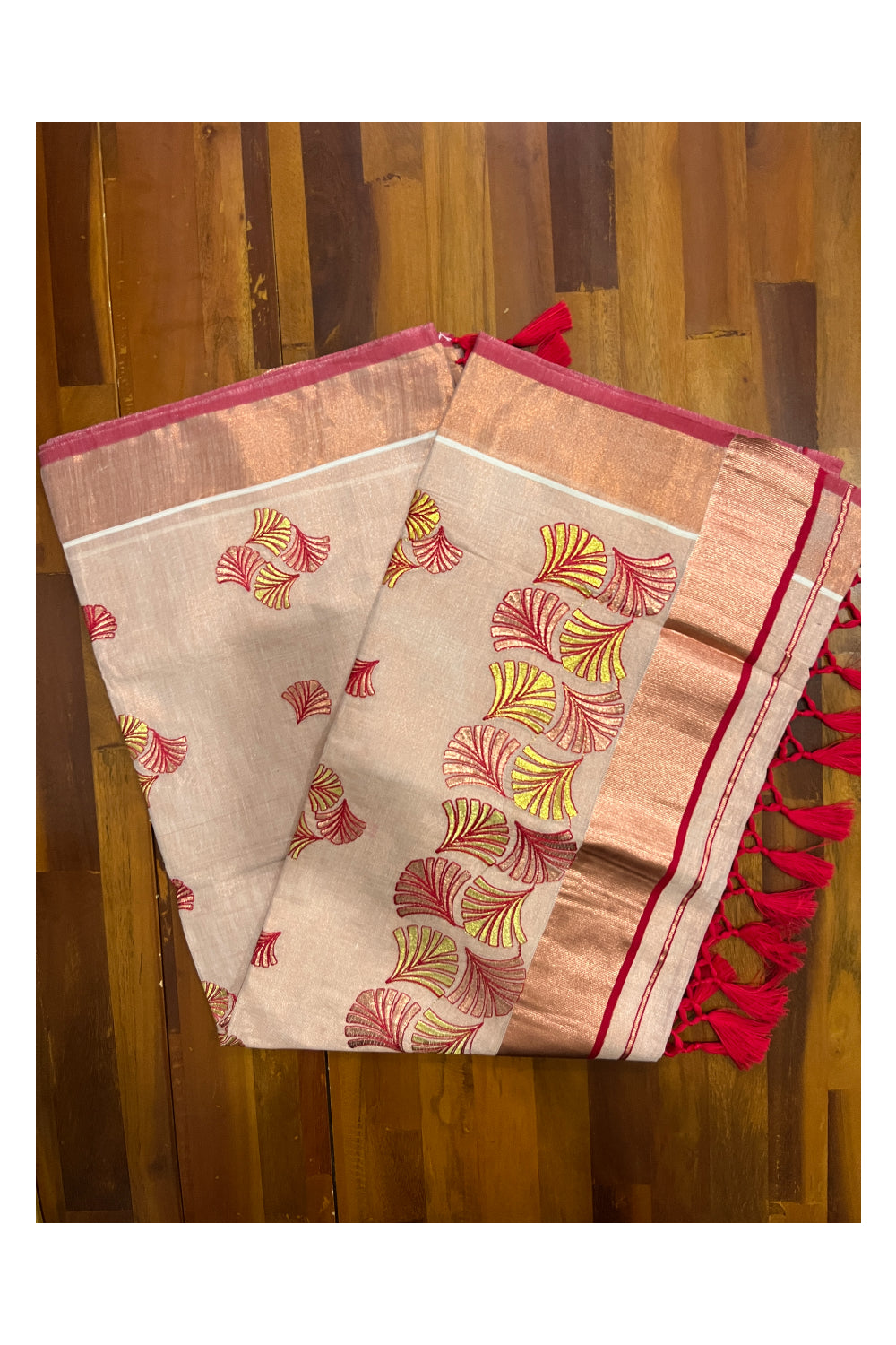 Southloom Copper Tissue Kasavu Saree with Embroidery Design and Red Tassels Works on Pallu