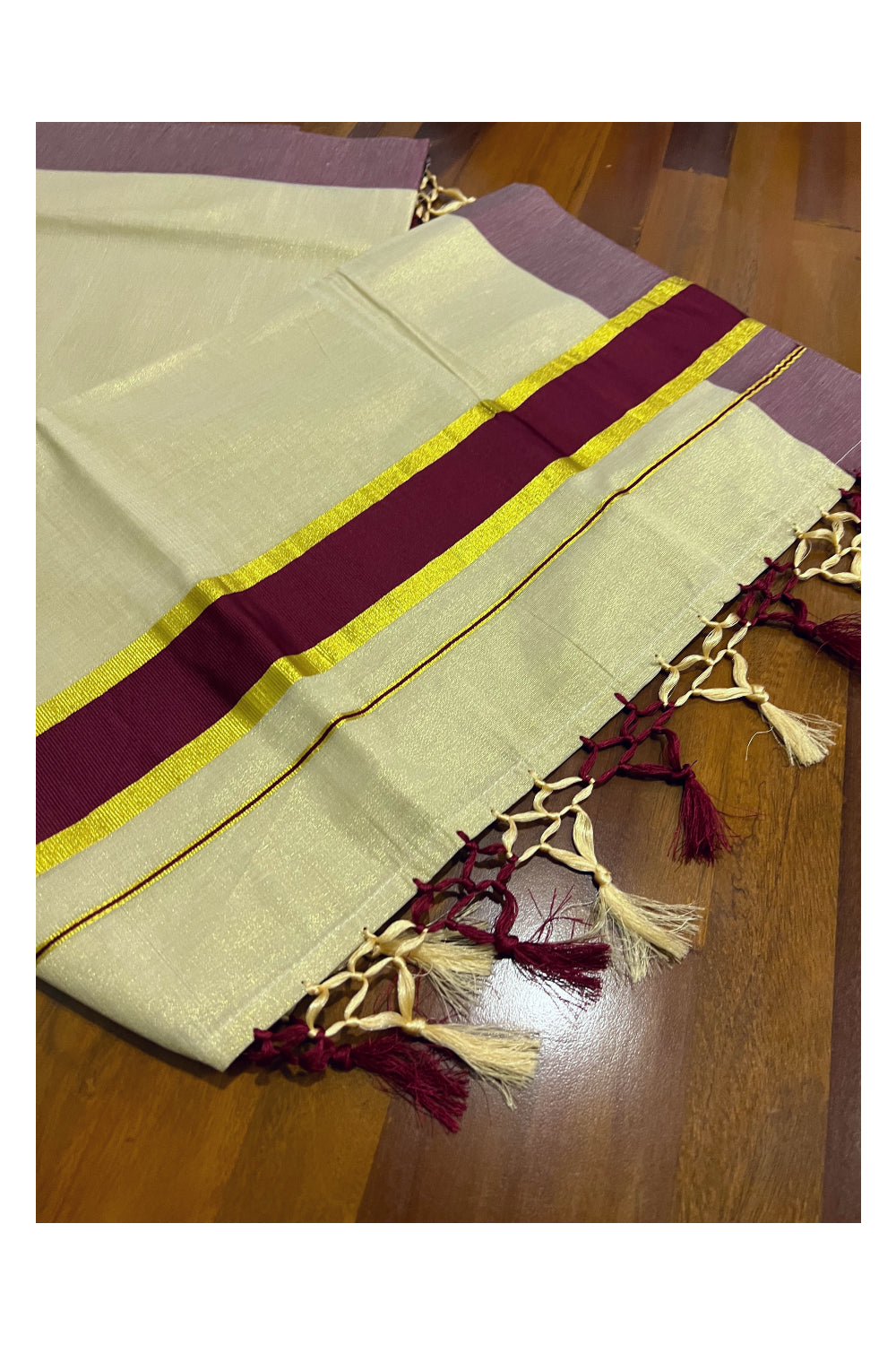 Kerala Kasavu Tissue Plain Saree with Maroon and Kasavu Border and Tassels Work on Pallu