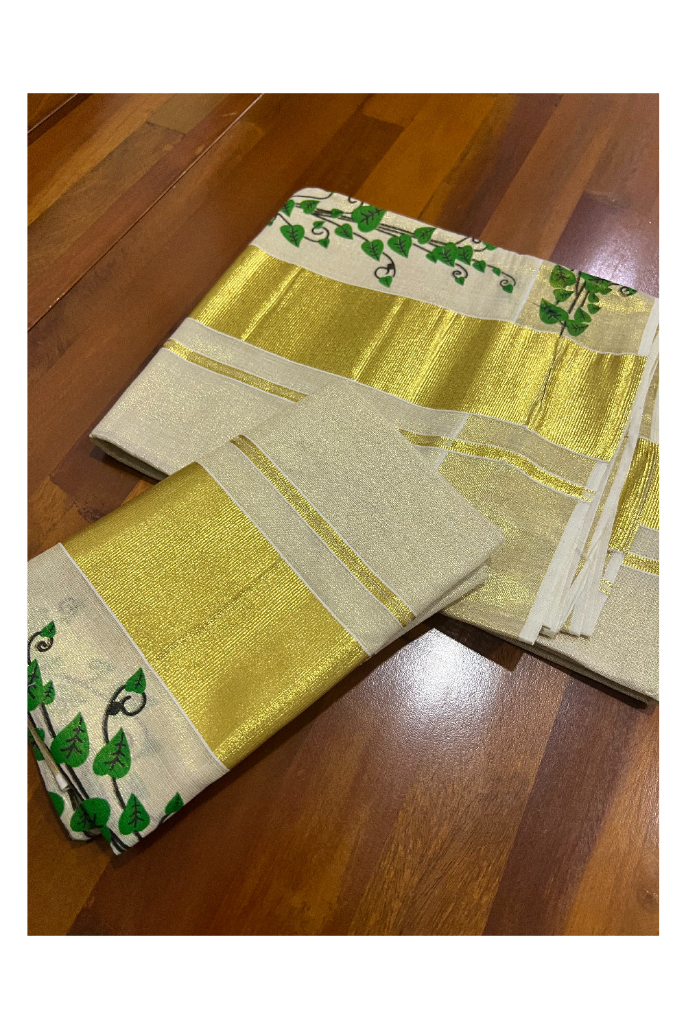 Kerala Tissue Kasavu Set Mundu (Mundum Neriyathum) with Green Leaf Mural Works