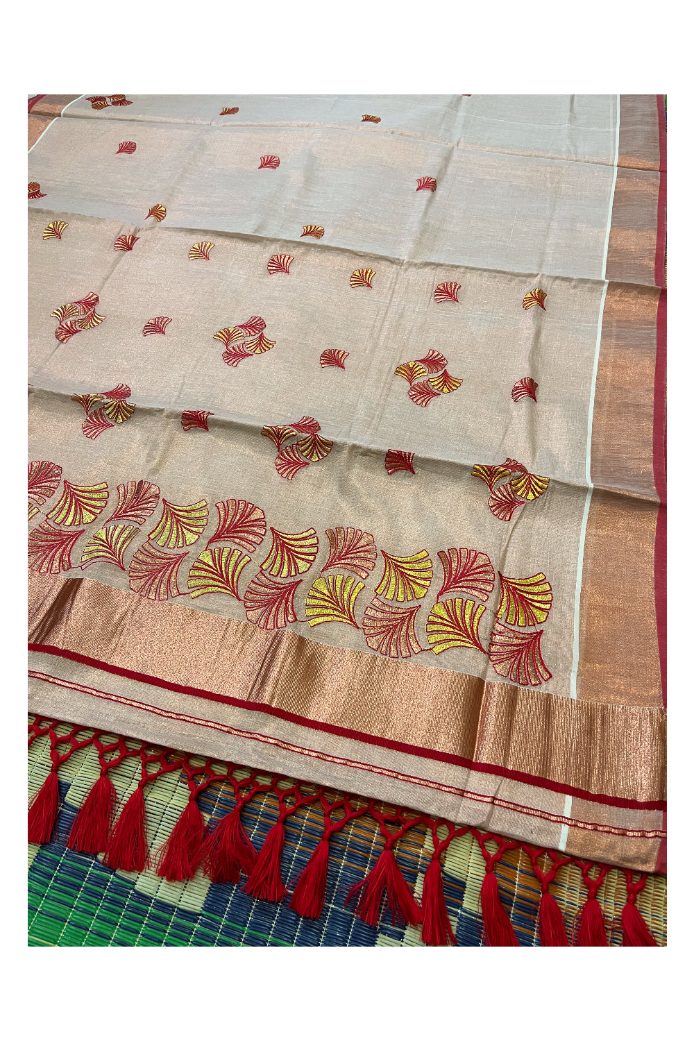 Southloom Copper Tissue Kasavu Saree with Embroidery Design and Red Tassels Works on Pallu