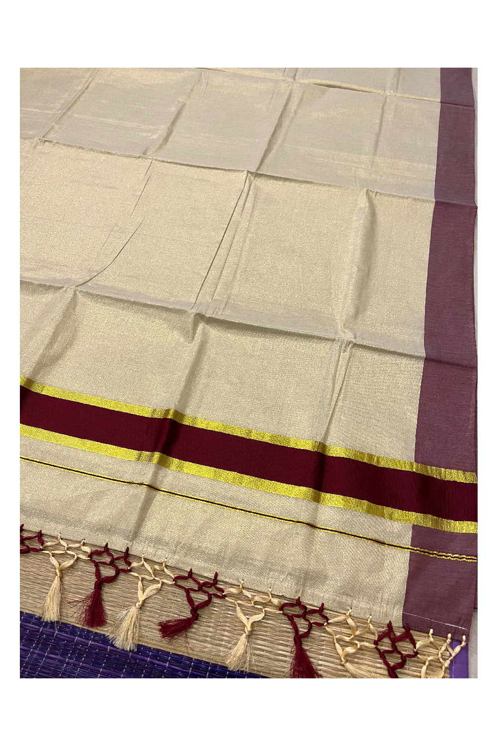 Kerala Kasavu Tissue Plain Saree with Maroon and Kasavu Border and Tassels Work on Pallu