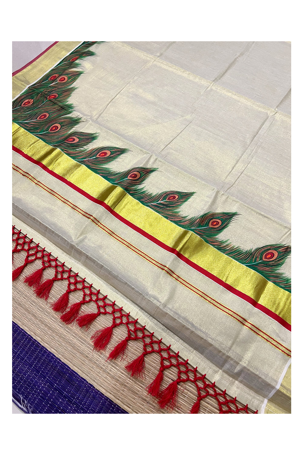 Kerala Tissue Kasavu Saree with Hand Painted Feather Design and Red Tassels Work