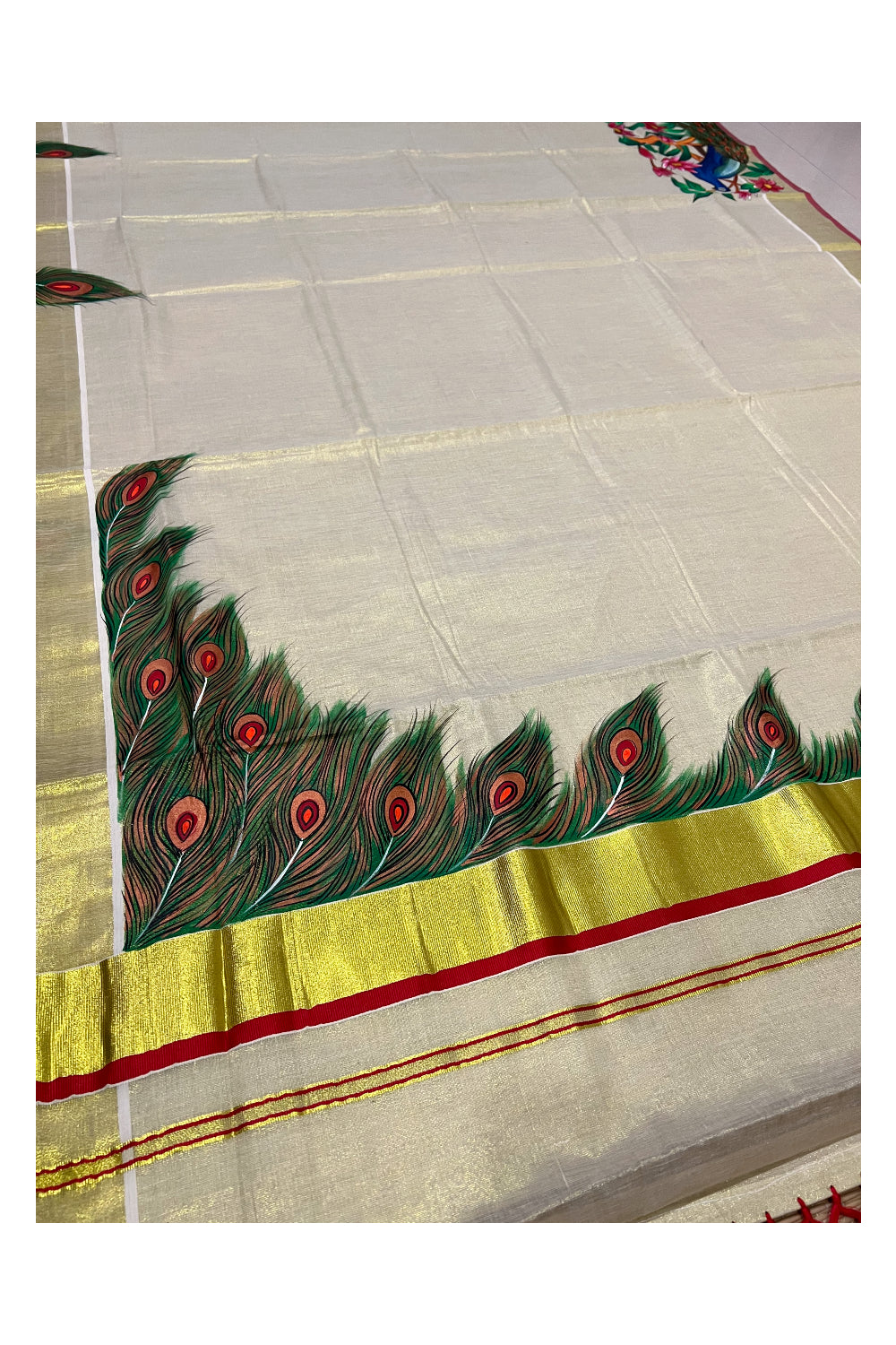 Kerala Tissue Kasavu Saree with Hand Painted Feather Design and Red Tassels Work