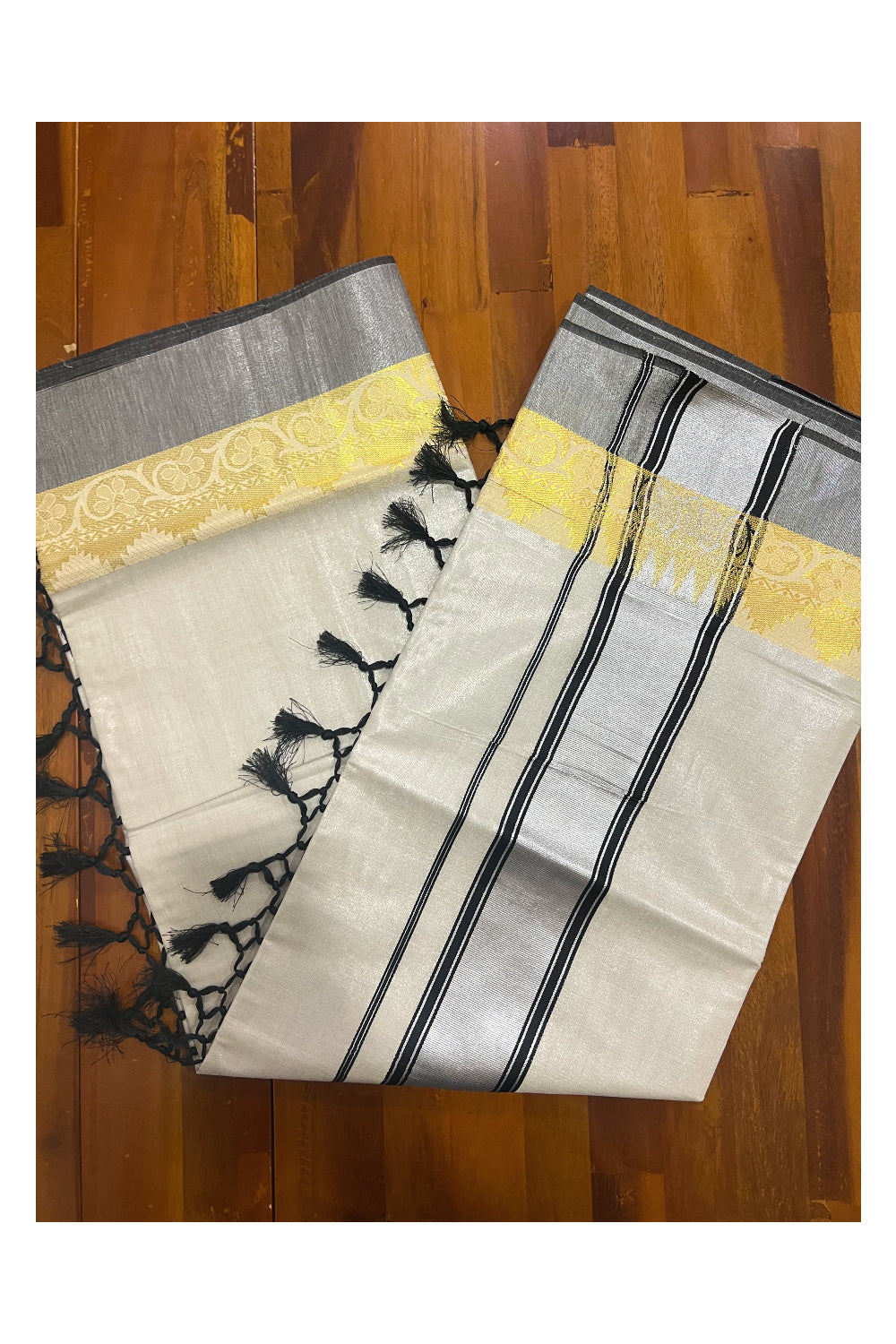 Kerala Silver Tissue Plain Saree with Black and Golden Floral Self Work Border