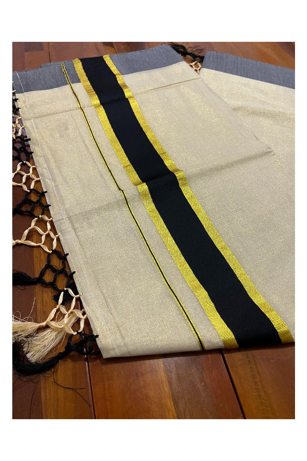 Kerala Kasavu Tissue Plain Saree with Black and Kasavu Border and Tassels Work on Pallu