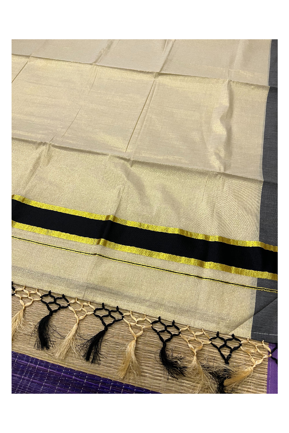 Kerala Kasavu Tissue Plain Saree with Black and Kasavu Border and Tassels Work on Pallu