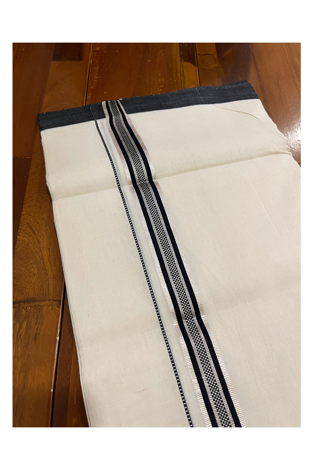 Southloom Premium Unakkupaavu Handloom Mundu with Silver Kasavu and Black Border (South Indian Dhoti)