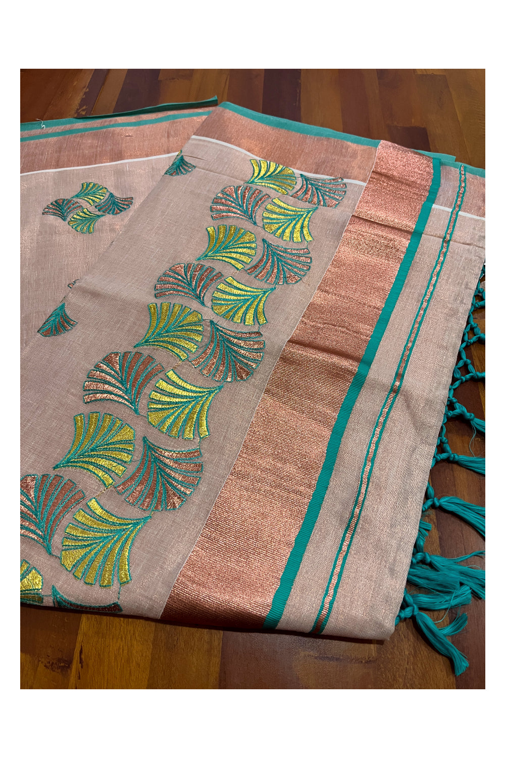 Southloom Copper Tissue Kasavu Saree with Embroidery Design and Turquoise Tassels Works on Pallu