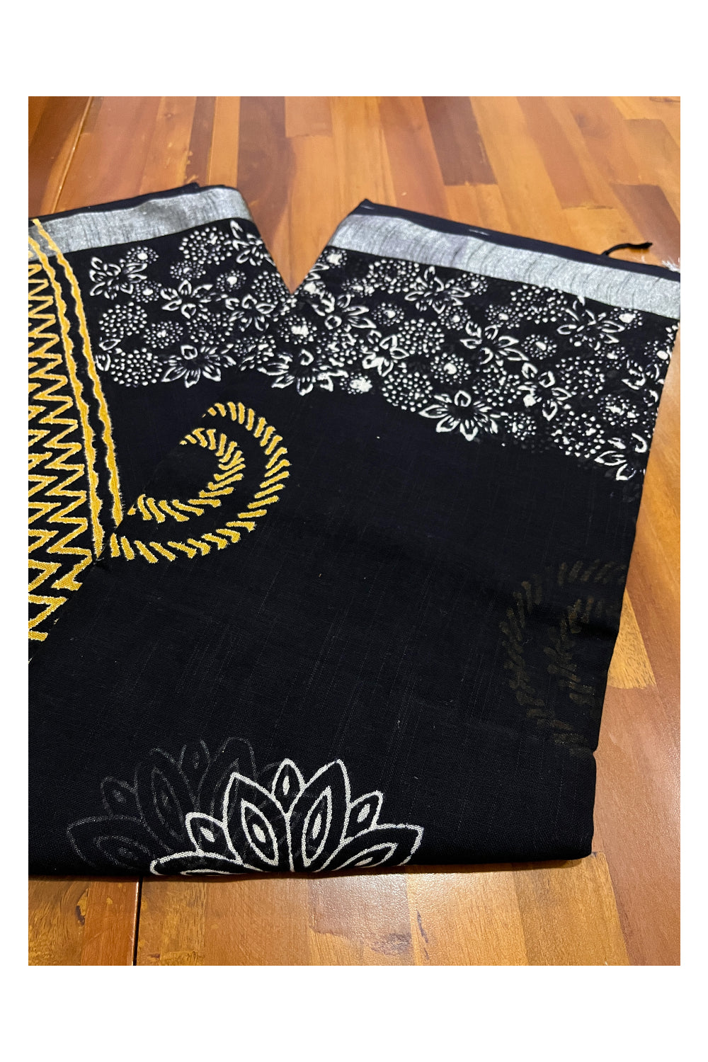 Southloom Linen Designer Black Saree with Yellow White Fabric Prints on Body and Tassels Works