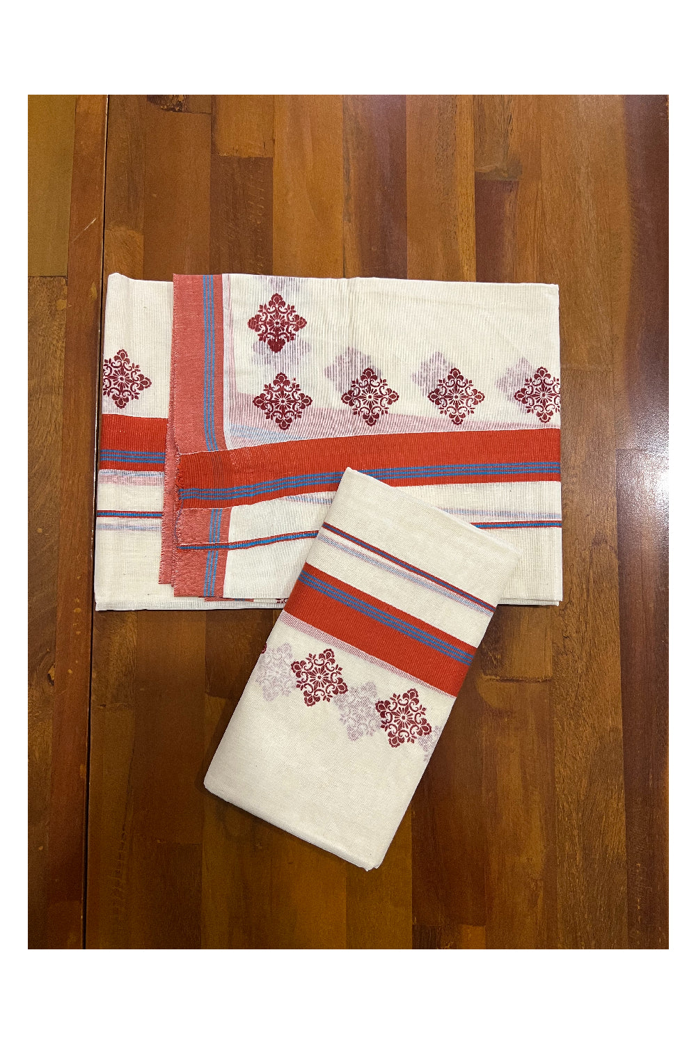 Pure Cotton Set Mundu (Mundum Neriyathum) with Dark Orange Floral Block Prints and Blue Lines on Border