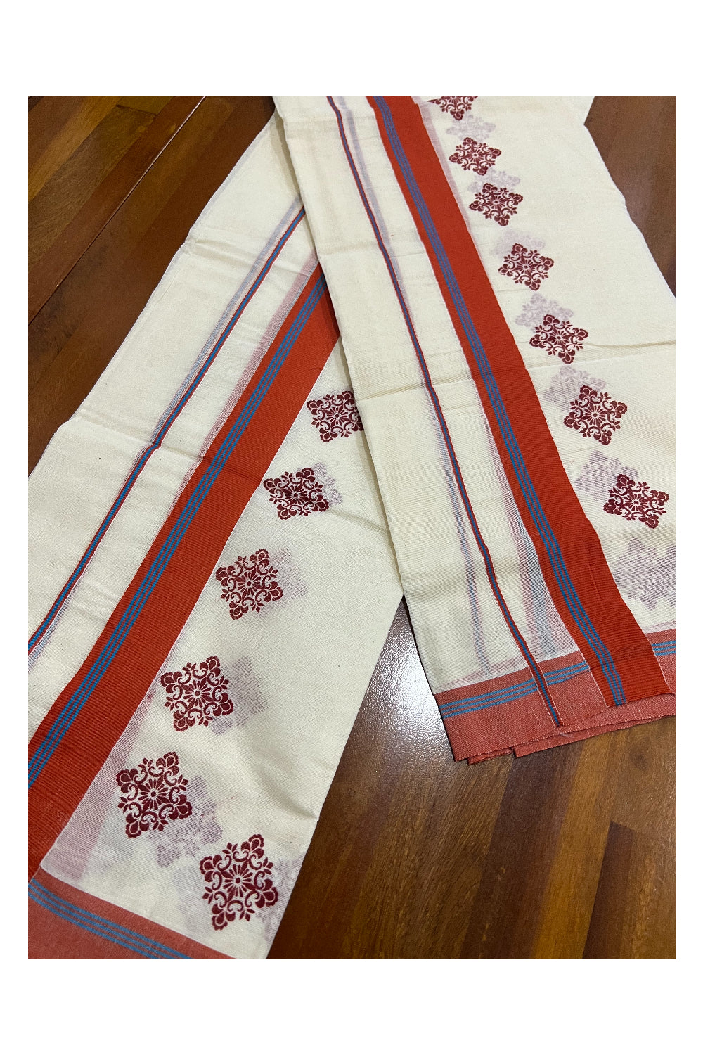 Pure Cotton Set Mundu (Mundum Neriyathum) with Dark Orange Floral Block Prints and Blue Lines on Border