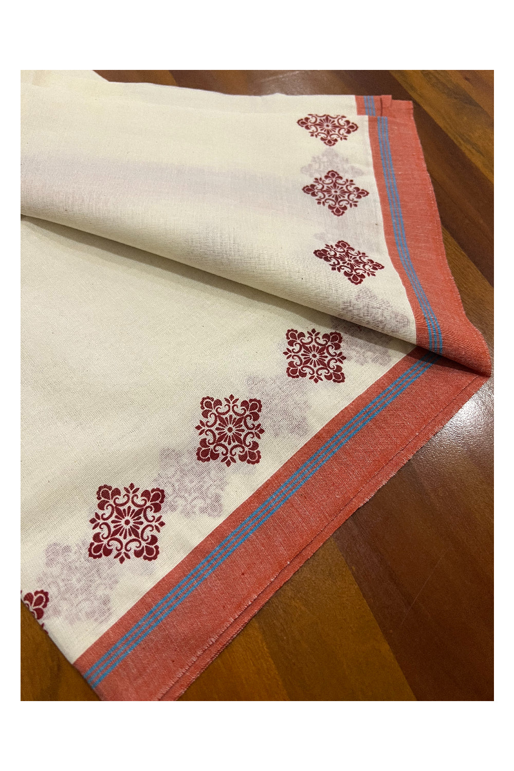 Pure Cotton Set Mundu (Mundum Neriyathum) with Dark Orange Floral Block Prints and Blue Lines on Border